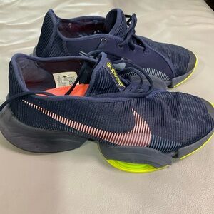 Nike men’s or women Dark Blue and Neon Orange Sneakers